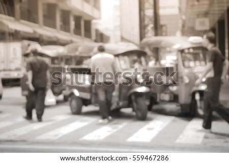 Blurred  background abstract and can be illustration to article of threewheeler classic motorised tuk-tuk taxi in Bangkok, Thailand