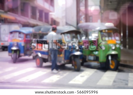 Blurred  background abstract and can be illustration to article of threewheeler classic motorised tuk-tuk taxi in Bangkok, Thailand