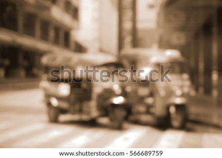 Blurred  background abstract and can be illustration to article of threewheeler classic motorised tuk-tuk taxi in Bangkok, Thailand