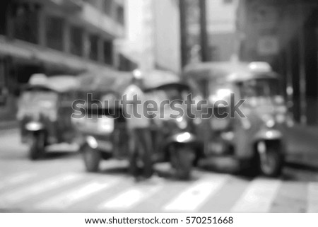Blurred  background abstract and can be illustration to article of threewheeler classic motorised tuk-tuk taxi in Bangkok, Thailand