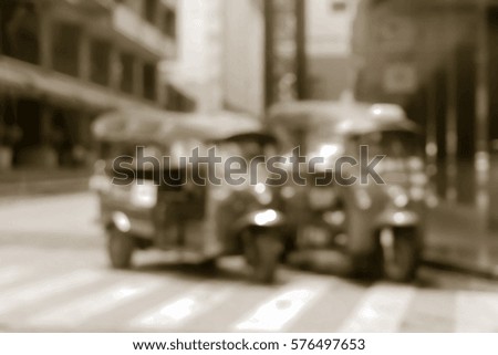Blurred  background abstract and can be illustration to article of threewheeler classic motorised tuk-tuk taxi in Bangkok, Thailand