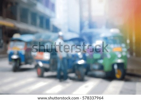 Blurred  background abstract and can be illustration to article of threewheeler classic motorised tuk-tuk taxi in Bangkok, Thailand