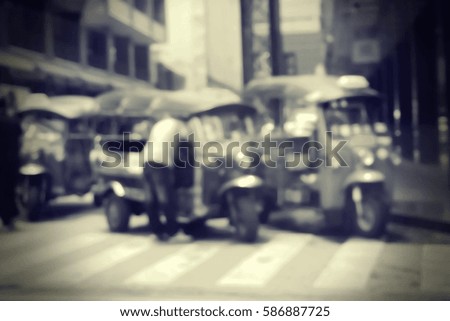Blurred  background abstract and can be illustration to article of threewheeler classic motorised tuk-tuk taxi in Bangkok, Thailand