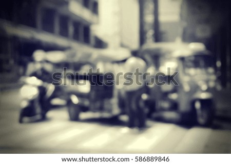 Blurred  background abstract and can be illustration to article of threewheeler classic motorised tuk-tuk taxi in Bangkok, Thailand