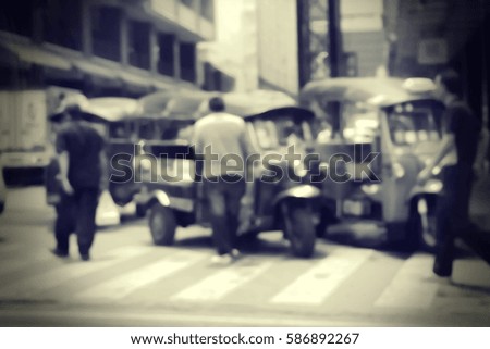 Blurred  background abstract and can be illustration to article of threewheeler classic motorised tuk-tuk taxi in Bangkok, Thailand