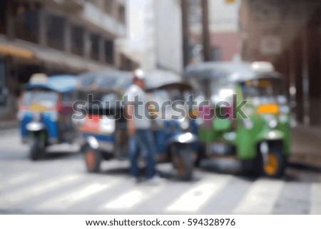 Blurred  background abstract and can be illustration to article of threewheeler classic motorised tuk-tuk taxi in Bangkok, Thailand