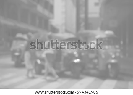 Blurred  background abstract and can be illustration to article of threewheeler classic motorised tuk-tuk taxi in Bangkok, Thailand