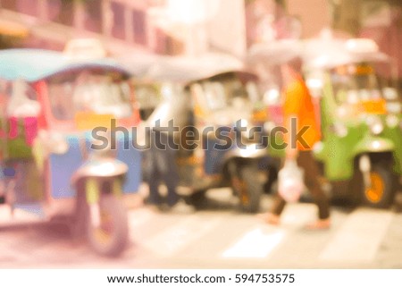 Blurred  background abstract and can be illustration to article of threewheeler classic motorised tuk-tuk taxi in Bangkok, Thailand