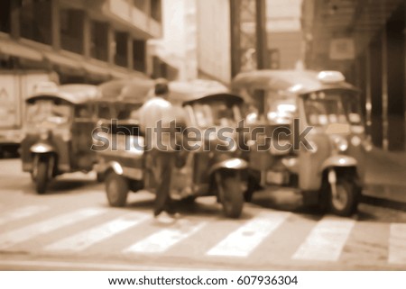 Blurred  background abstract and can be illustration to article of threewheeler classic motorised tuk-tuk taxi in Bangkok, Thailand