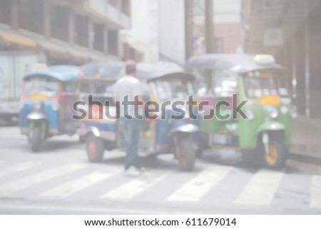 Blurred  background abstract and can be illustration to article of threewheeler classic motorised tuk-tuk taxi in Bangkok, Thailand