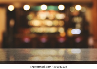 Blurred Background Of Bar And Black Desk Space 