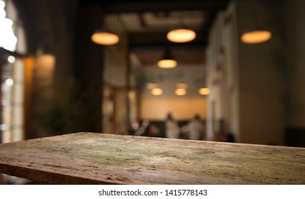 blurred background of bar and dark brown desk space of retro wood - Shutterstock ID 1415778143