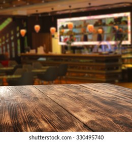 Blurred Background Of Bar And Wooden Board 