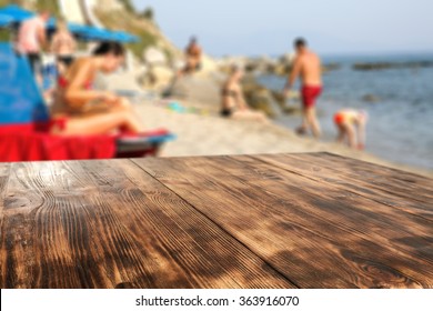 Blurred Background Of Beach And Table And Yellow Sand 