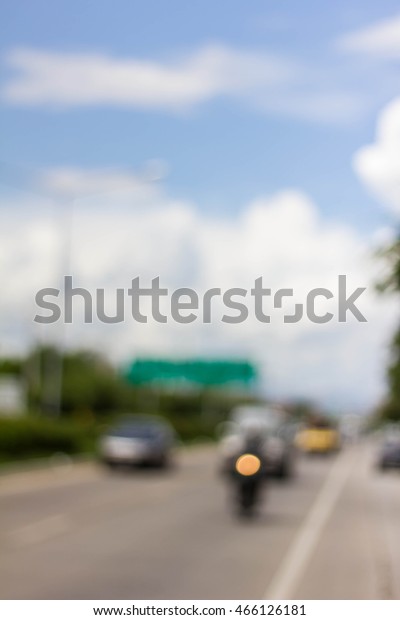Blurred\
background : Blur of car on road in the city\
