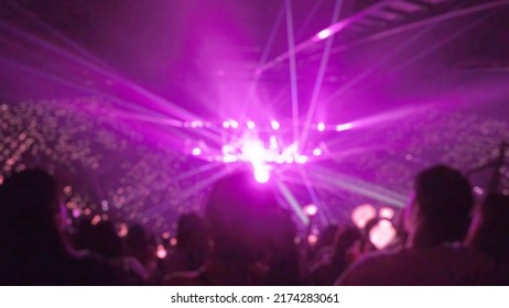 Blurred Background, Bokeh, Silhouette Of Cheering Audience, Lighting On The Stage In Indoor Concert 