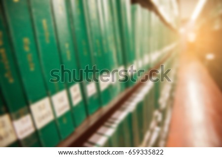 blurred background of books in public library. Education concept.