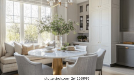 Blurred background of bright and inviting transitional breakfast nook featuring a round marble table, plush seating, and abundant natural light, creating a cozy dining atmosphere.
