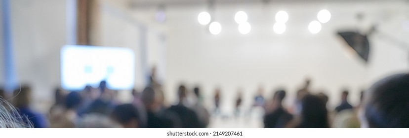 Blurred Background Of The Business Conference, A Group Of People On The Stage, Presentation Of The Project, Public Talk. High Quality Banner With Copy Space