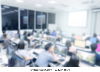 Blurred background of business people in conference hall or seminar room with desktop computer. - Shutterstock ID 1132445594