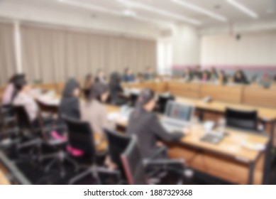 Blurred background of business people in conference hall or seminar room. - Shutterstock ID 1887329368