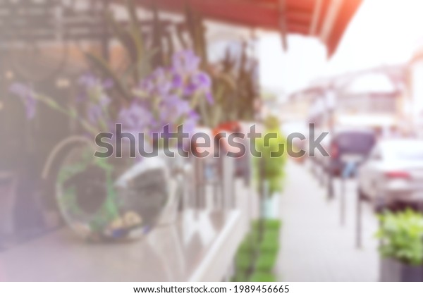 Blurred background : Cafe, street, cars blur\
background. Outdoor.