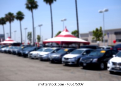 Blurred Background Of Car Dealership Lot                               