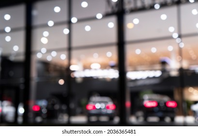 Blurred Background With Car Dealership Exterior. Abstract Blurred Photo Of Modern Building Motor Showroom. Blur Car Show Room Office Bokeh Lights. Automobile Retail Shop