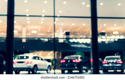 Blurred Background With Car Dealership Exterior. Abstract Blurred Photo Of Modern Building Motor Showroom. Blur Car Show Room Office Bokeh Lights. Automobile Retail Shop