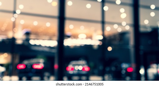 Blurred Background With Car Dealership Exterior. Abstract Blurred Photo Of Modern Building Motor Showroom. Blur Car Show Room Office Bokeh Lights. Automobile Retail Shop