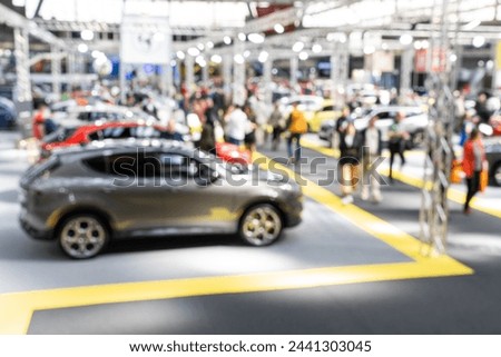 Blurred background of car show exposition