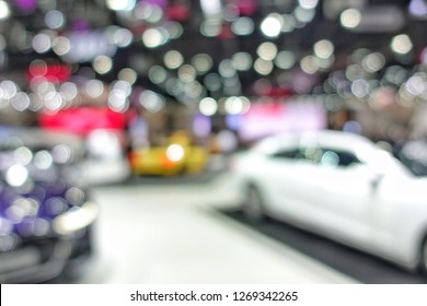 Blurred Background Of Car In Showroom With No Body.Concept For Transportation Template