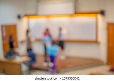 Blurred Background Of Classroom Activity In High School, Collage, Or University Campus - Education Or Academic Concept Image For Graphic Design To Go With Educational Article Or Academic Essay Topic 