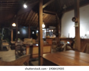 A Blurred Background Of A Coffee Shop At Night