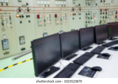 Blurred background of  computer control switch auto system for working at System Control Center room is many of screens displaying various Information to data analysis in the industry.