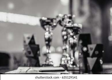 blurred background concept of winners cups in stage color lighting shining like a diamond concept of winning sport competition  - Shutterstock ID 635129141