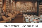 Blurred background of cozy bookstore interior with wooden shelves filled with books, comfortable seating areas, and a warm inviting atmosphere for readers and book lovers