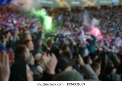 Blurred background of crowd of people at the stadium - Shutterstock ID 1334331089