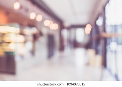 Blurred background of customer sitting in coffee shop or cafe restaurant with bokeh light. - Shutterstock ID 1034078515