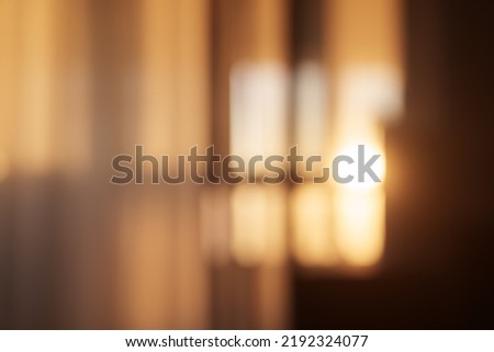 Blurred background of dining room with natural light from a window, backdrop