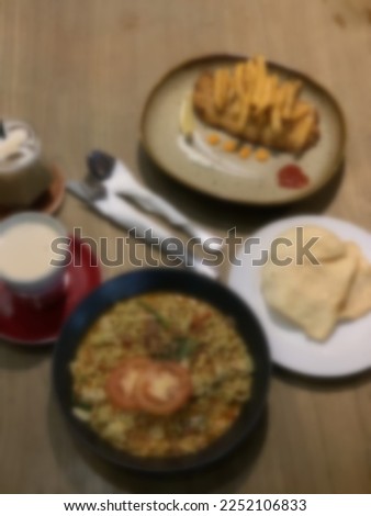.Blurred background of dining situation on wooden table