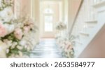 Blurred background of elegant hallway features soft pastel colors and beautiful floral arrangements, creating a romantic atmosphere perfect for weddings or special events.