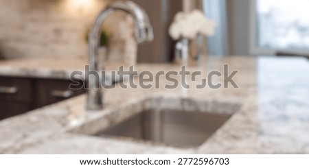 Blurred Background of Elegant kitchen sink with shiny chrome faucet on stunning marble countertop, showcasing modern design and upscale home decor in bright interior space