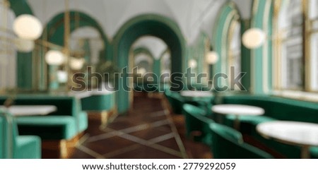 Blurred Background of Elegant modern cafe interior design featuring green velvet seating and golden accents in a bright, airy atmosphere with arched windows and tasteful decor