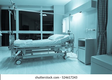 Blurred background of Empty Bed in the room hospital in blue tone, Blurred background.