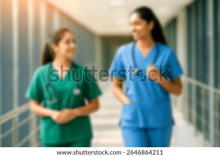 blurred for background. blurred figures of doctors and nurses in a hospital corridor. Doctors and nurses walking in hospital hallway. blurred motion. Moving human figure in the clinic corridor
