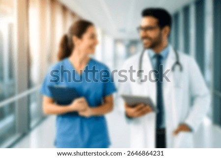 blurred for background. blurred figures of doctors and nurses in a hospital corridor. Doctors and nurses walking in hospital hallway. blurred motion. Moving human figure in the clinic corridor
