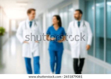 blurred for background. blurred figures of doctors and nurses in a hospital corridor. Doctors and nurses walking in hospital hallway. blurred motion. Moving human figure in the clinic corridor
