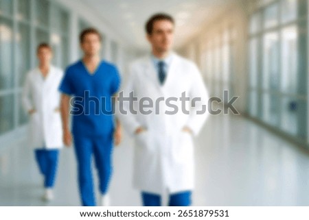 blurred for background. blurred figures of doctors and nurses in a hospital corridor. Doctors and nurses walking in hospital hallway. blurred motion. Moving human figure in the clinic corridor

