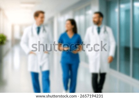 blurred for background. blurred figures of doctors and nurses in a hospital corridor. Doctors and nurses walking in hospital hallway. blurred motion. Moving human figure in the clinic corridor
